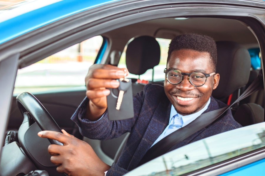 Man Driving a Blue Car
